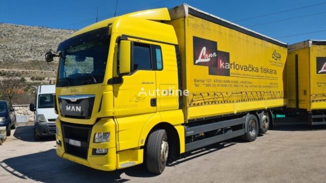 truk penyiang MAN 26.440 + trailer yang bisa dimiringkan